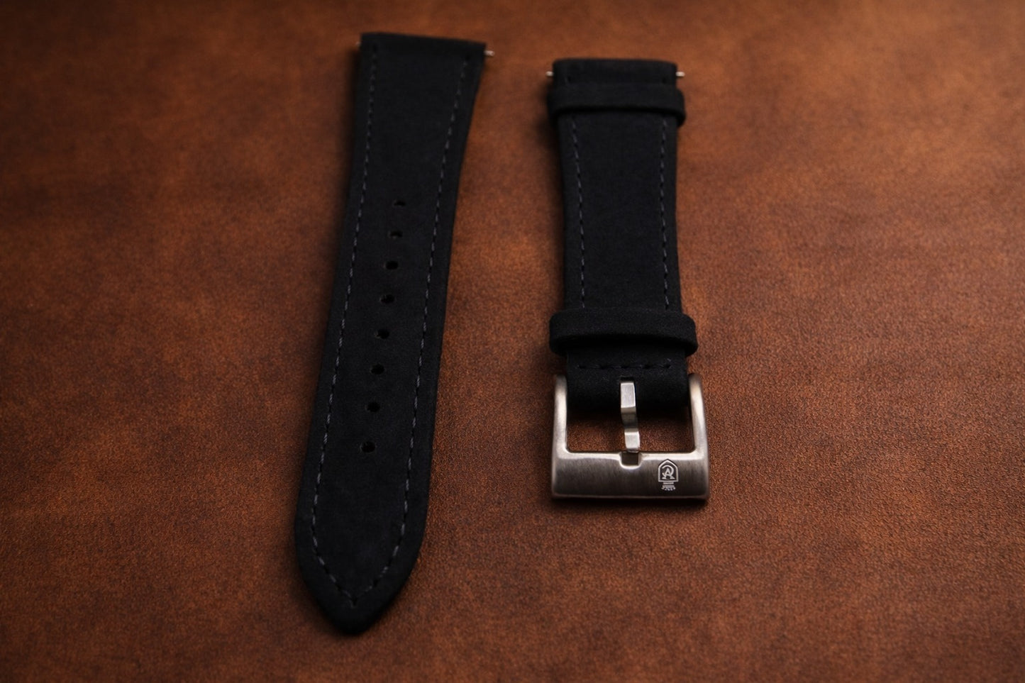 Top grain black leather watch strap with reinforced stitching and brushed steel buckle, classic replacement band for dress and everyday watches.